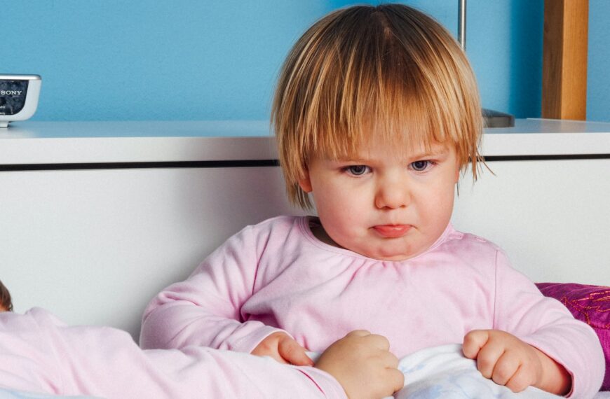 boy wearing pink long-sleeved top