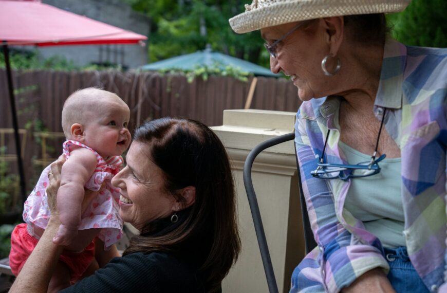 a man holding a baby