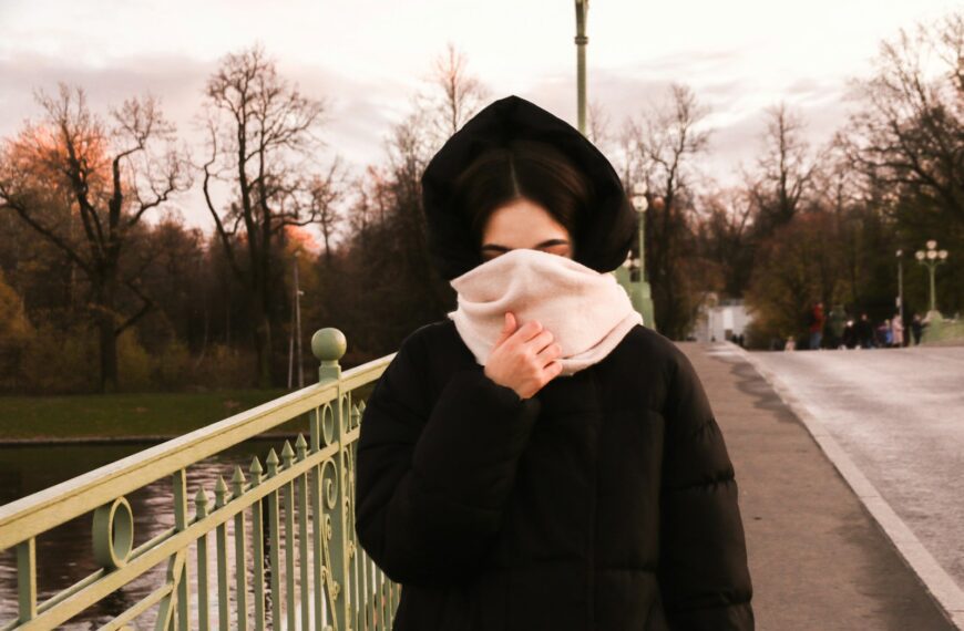 woman covering her face with her scarf