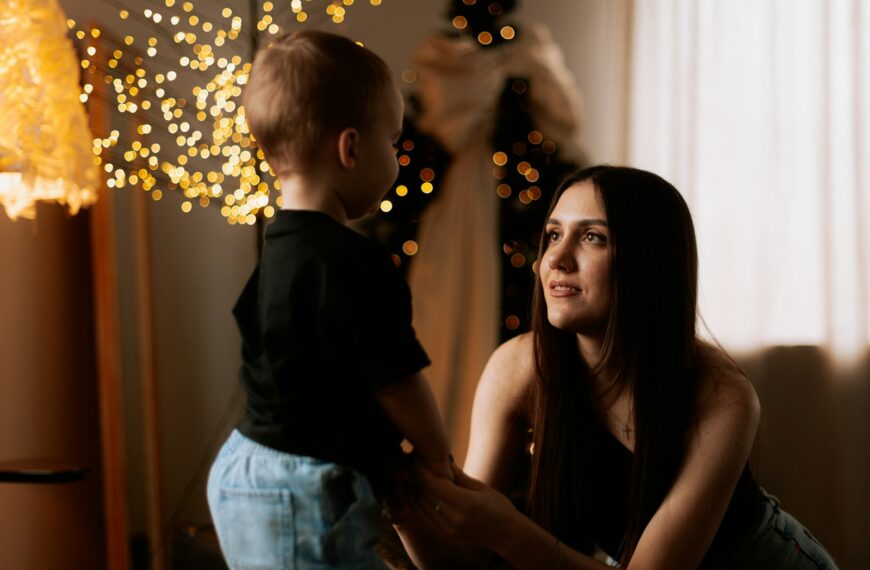 A woman holding a small child in her arms