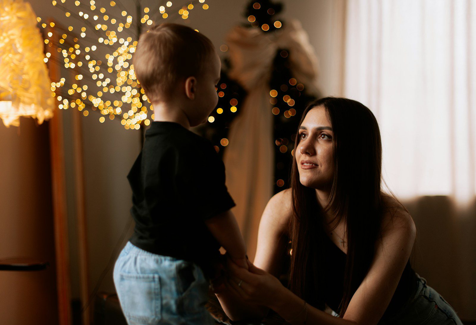 A woman holding a small child in her arms