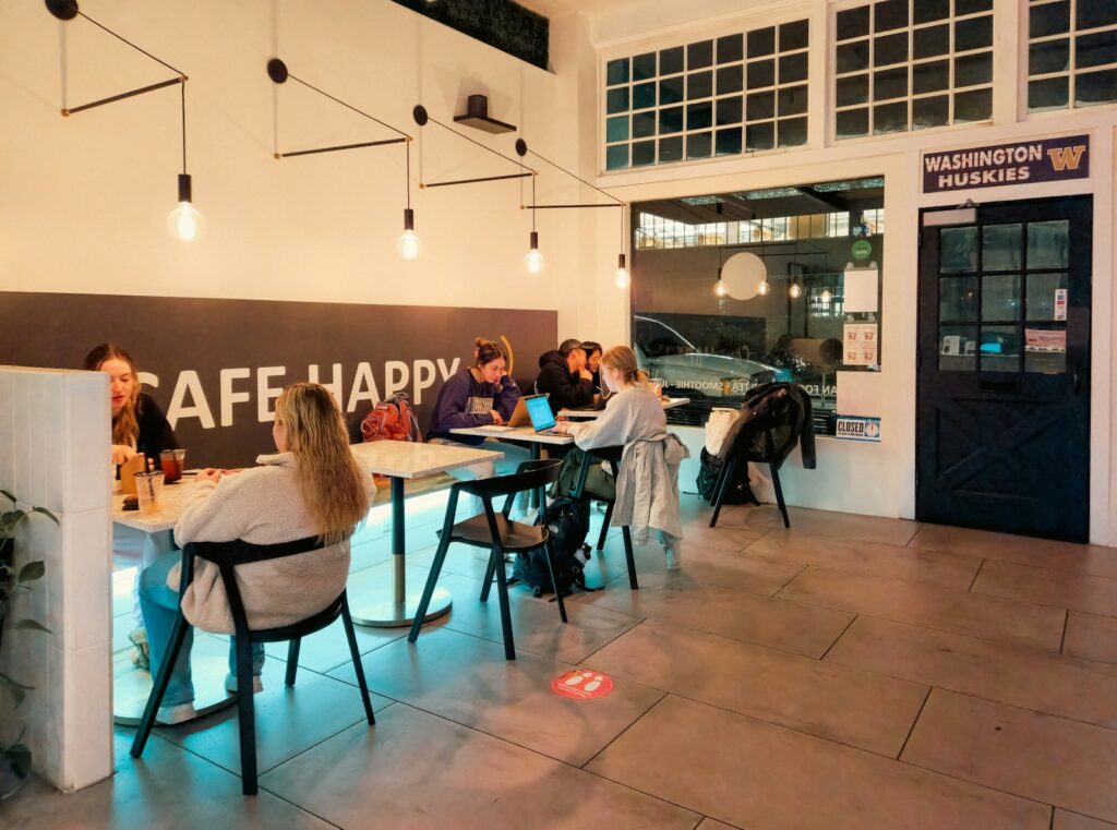 People sit and work inside a "cafe happy".
