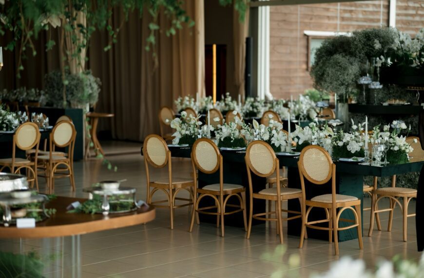 Elegant event tables set with white flowers and chairs