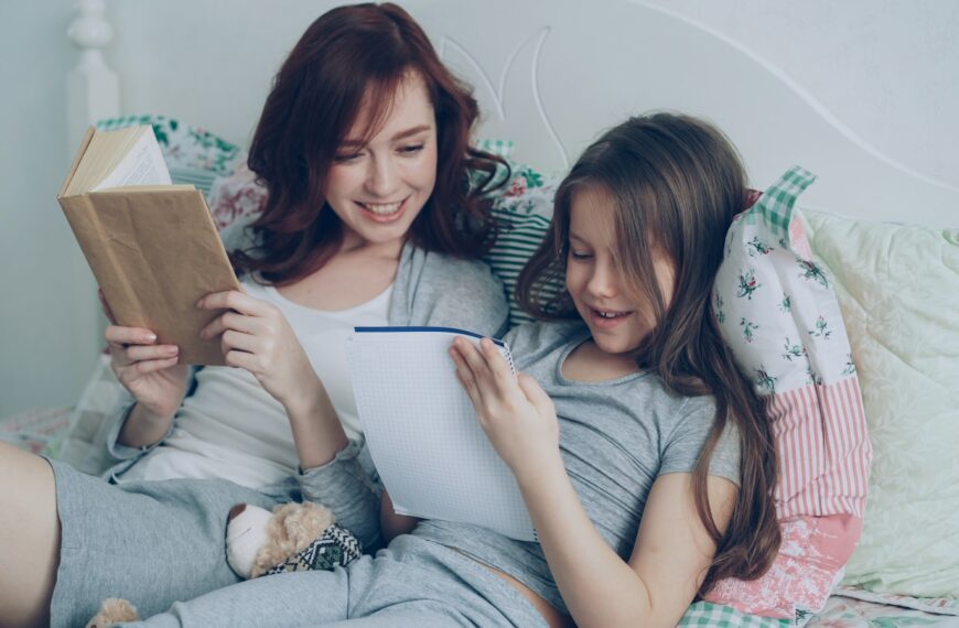 Mother and daughter enjoy reading together.