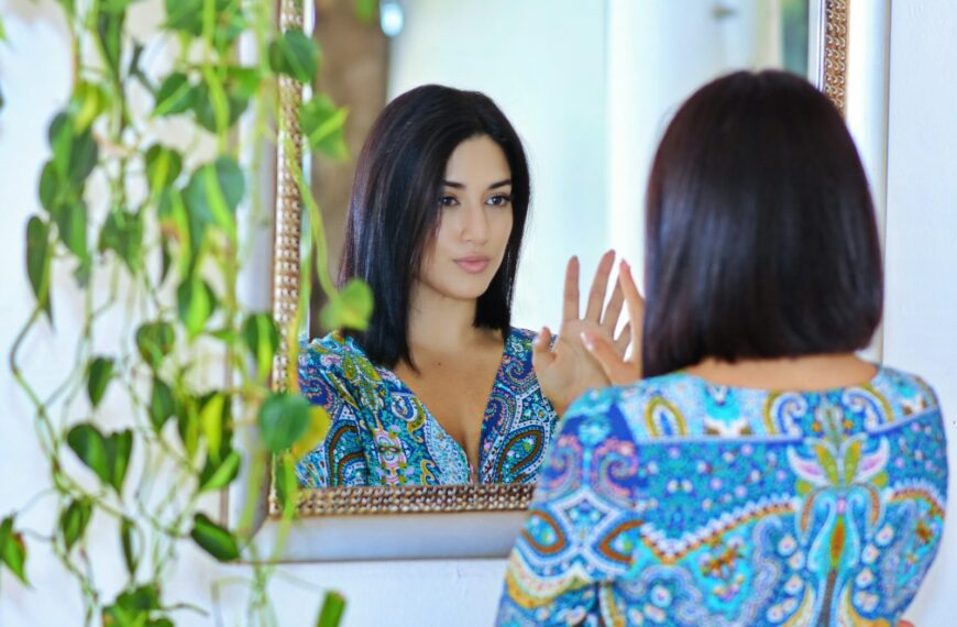 woman in blue and white floral dress