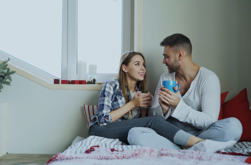 Couple enjoying drinks by the window