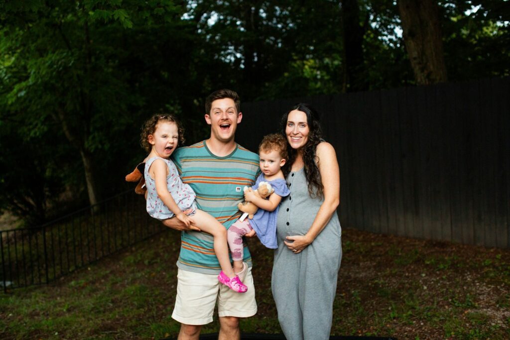 A man, woman and two children posing for a picture
