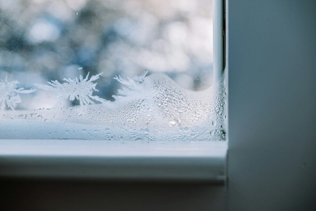 Frost patterns on a windowpane in winter