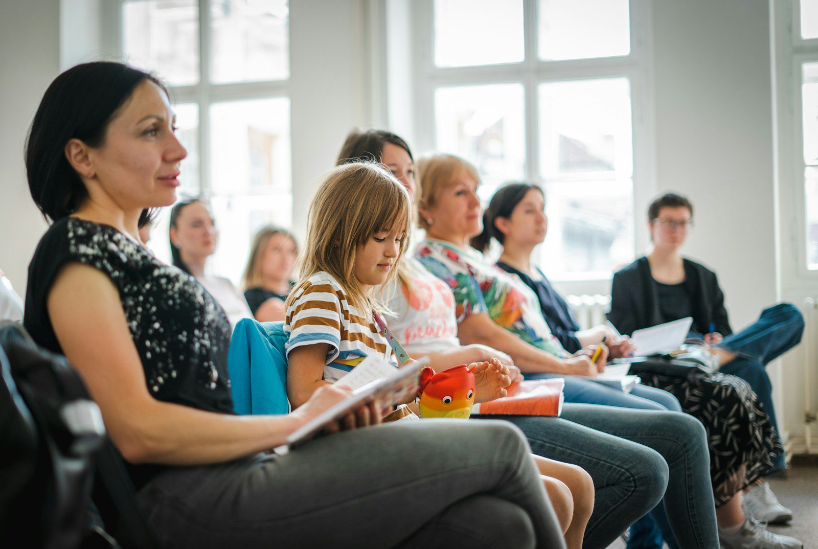a group of people sitting in a room