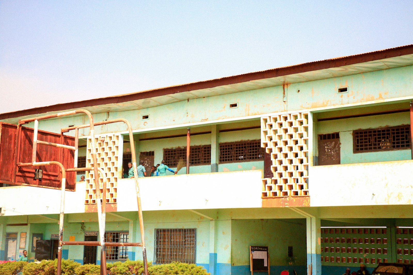 a blue and white building with a red fire hydrant