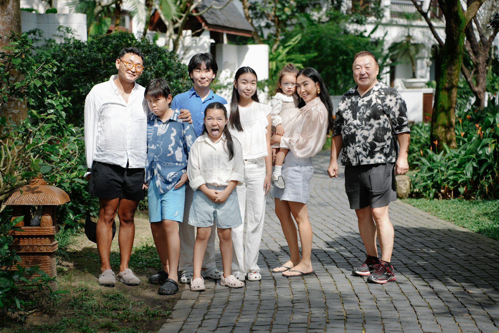 A family poses for a group outdoor portrait.