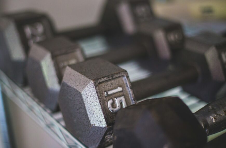 black dumbbells on white table