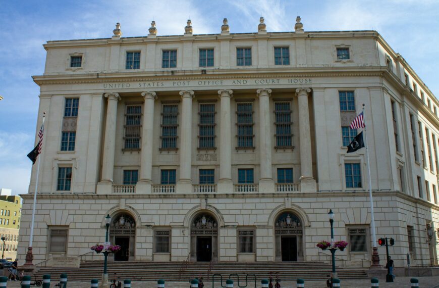 a large white building with a flag on top of it