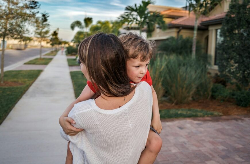 girl in white knit tank top standing on concrete pathway during daytime