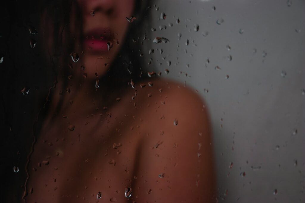 topless woman in shower room