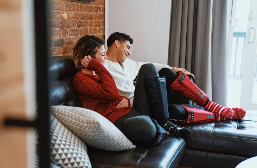 a man and woman sitting on a couch
