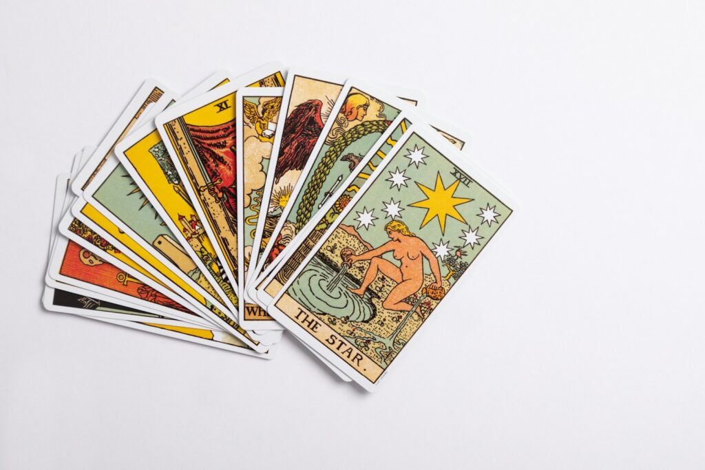 a deck of tarot cards on a white surface