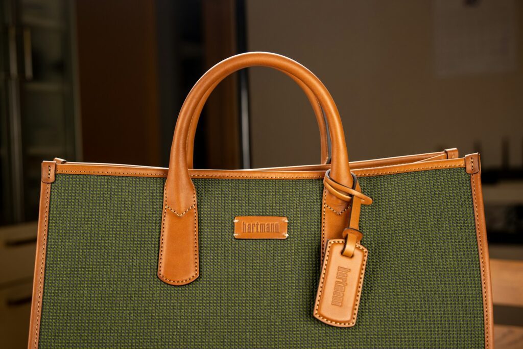 a brown handbag with a handle