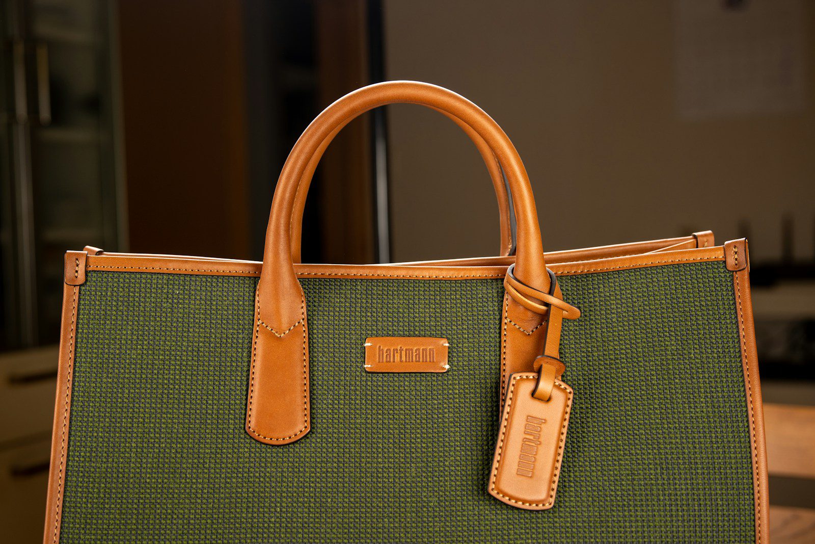 a brown handbag with a handle