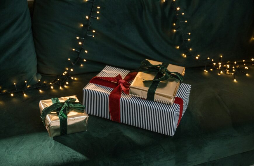a couple of wrapped presents sitting on top of a couch