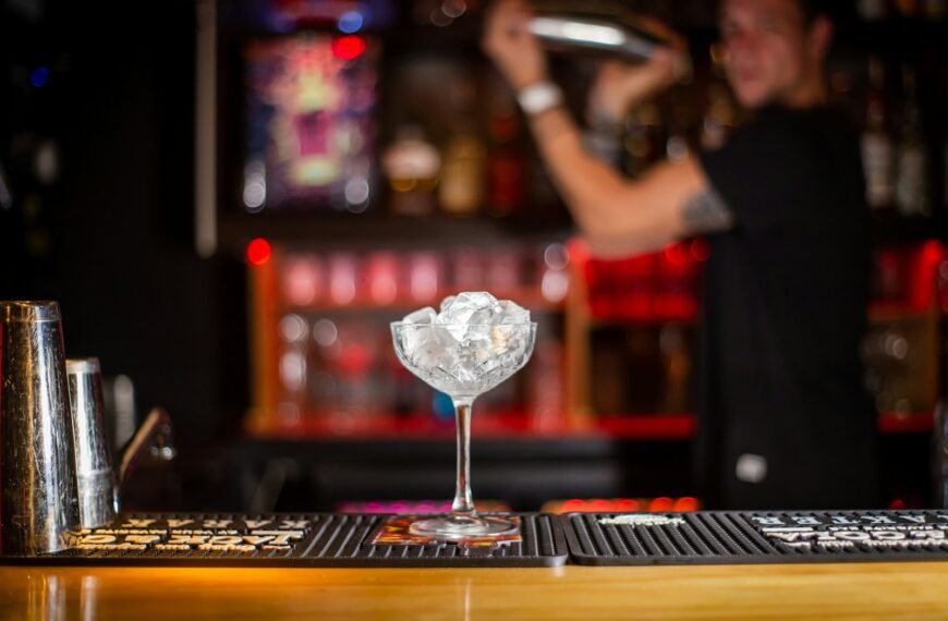 clear glass cup on brown wooden table