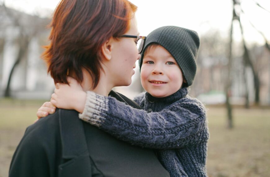 A heartwarming moment between a mother and child enjoying a day in the park.