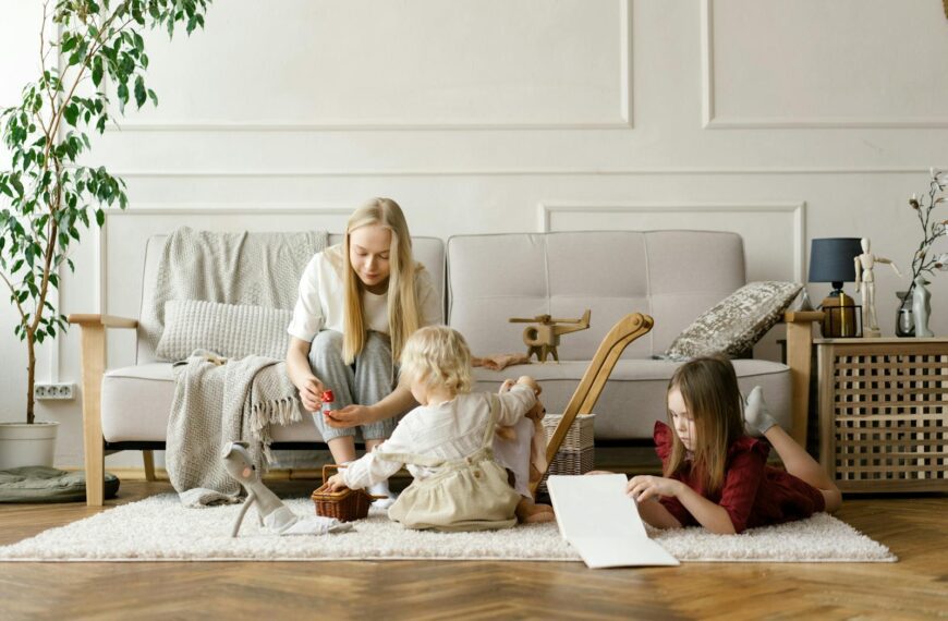 A family enjoying quality time with toys and books in a stylish living room.