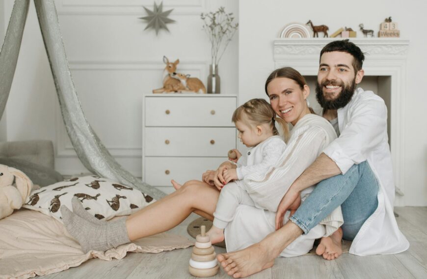 A loving family shares a joyful moment together in a stylish and cozy home environment.