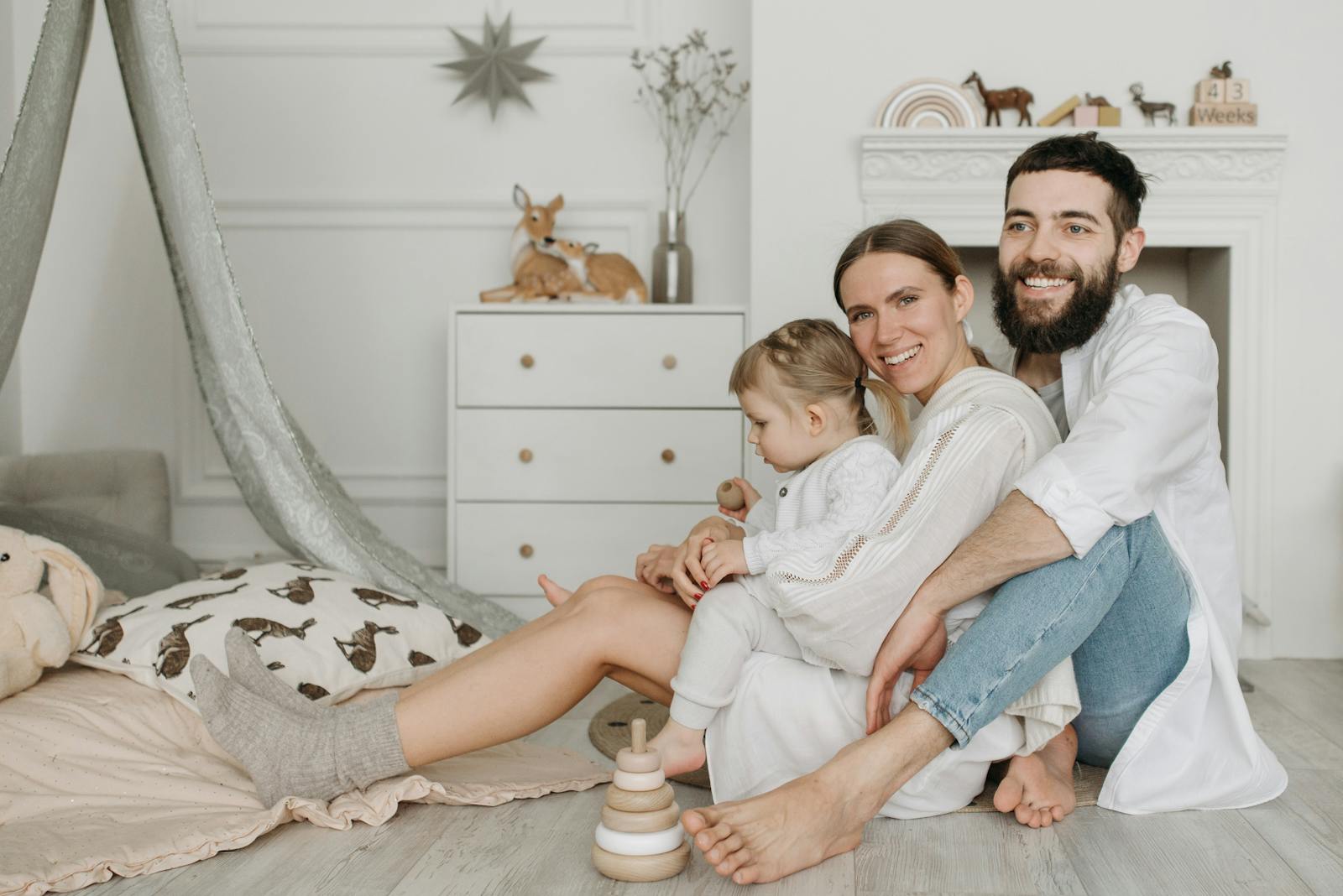 A loving family shares a joyful moment together in a stylish and cozy home environment.