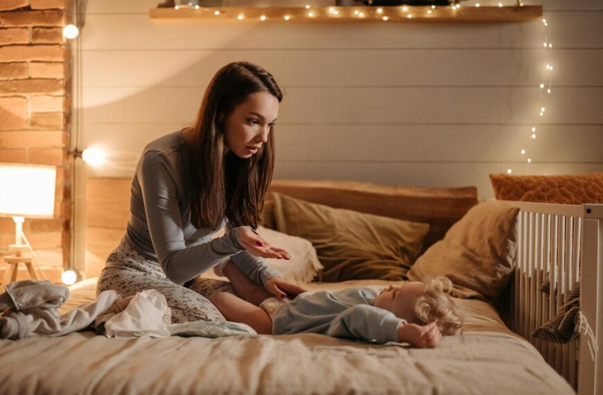 A mother and son enjoying bedtime together indoors with soft lighting and fairytale ambiance.