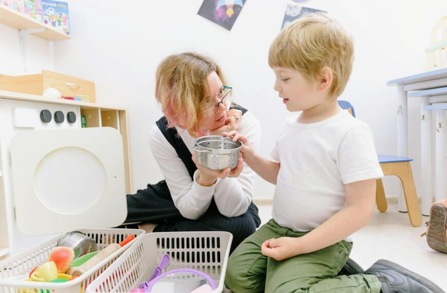 Child and teacher playing together in a bright classroom, fostering learning and fun.