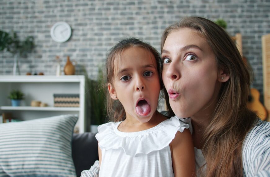 Mother and daughter making funny faces together