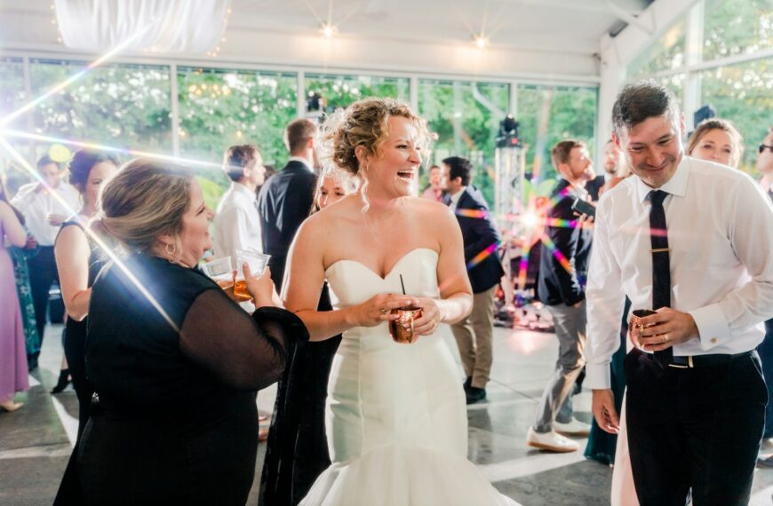 a bride and groom laughing at each other