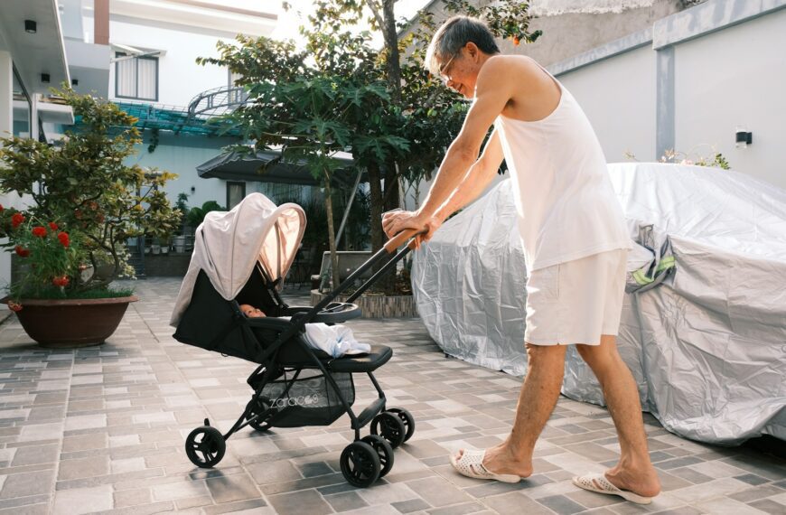 a man pushing a baby in a stroller