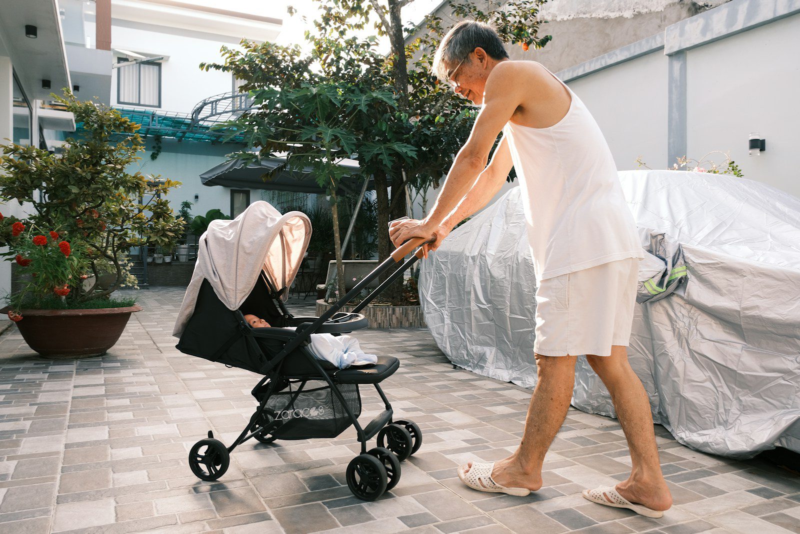 a man pushing a baby in a stroller