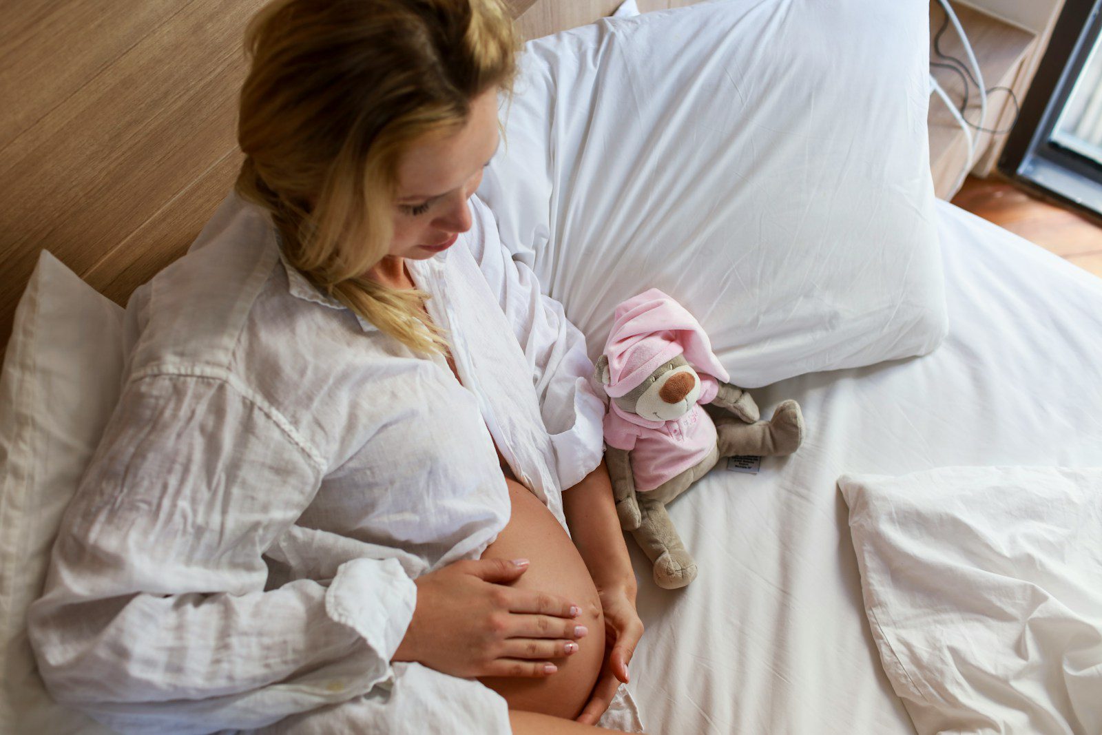 a person holding a stuffed animal