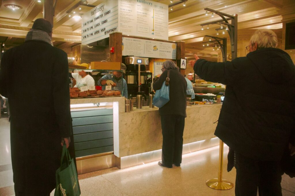 a group of people standing in front of a counter