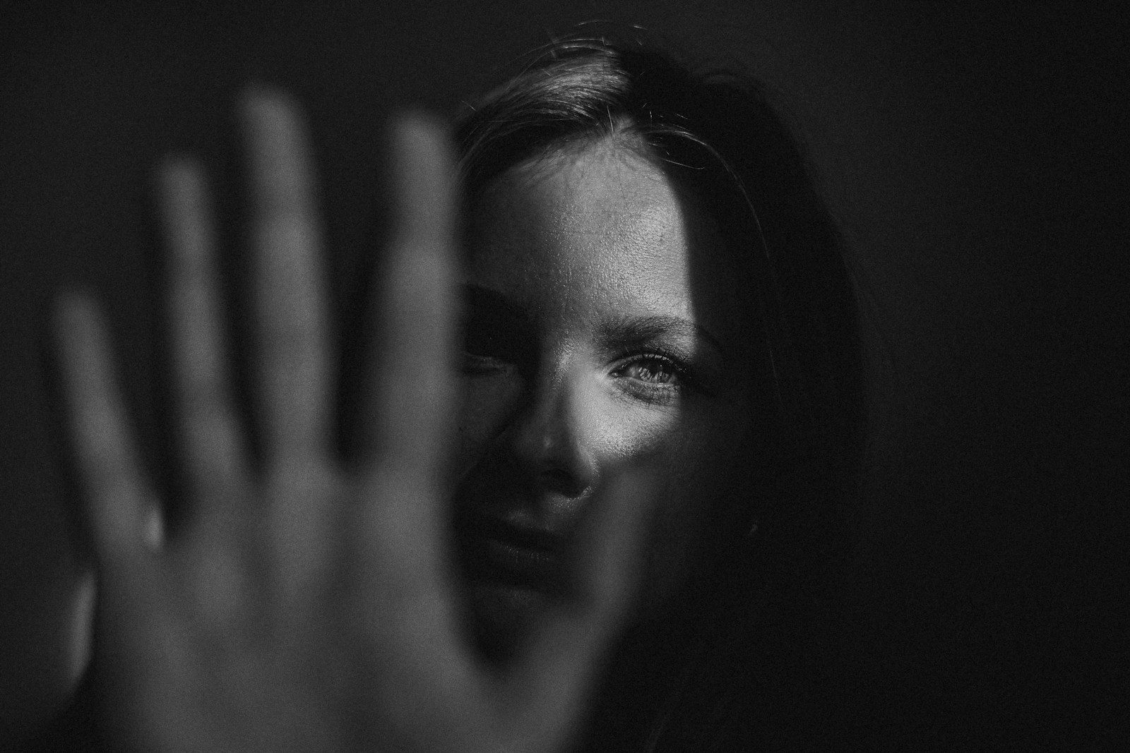 Woman partially hidden by her hand