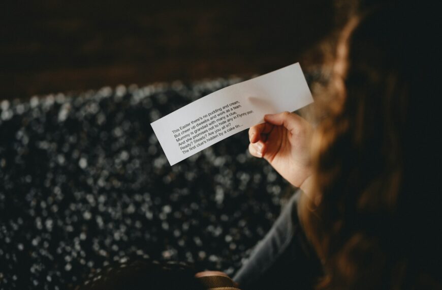 person holding white printer paper