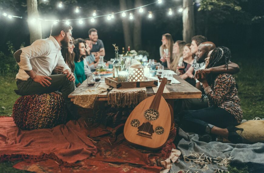 people sitting on chair in front of table with candles and candles