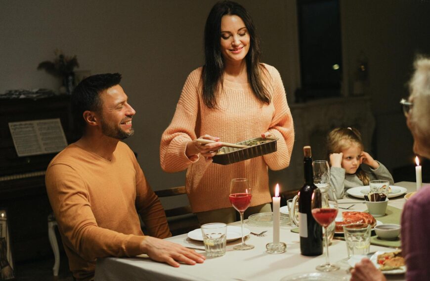 Warm family dinner with candles and wine, perfect for intimate home gatherings.