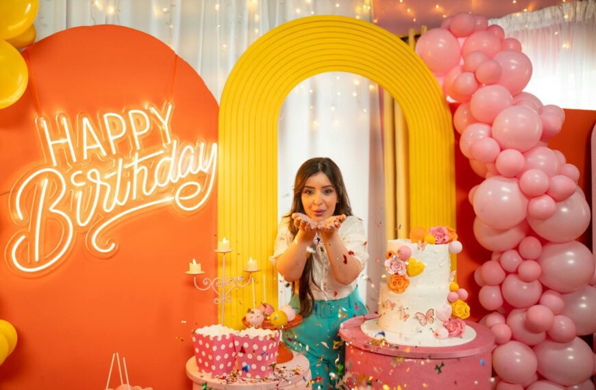 A festive birthday scene with a woman celebrating in colorful decor in Baghdad.