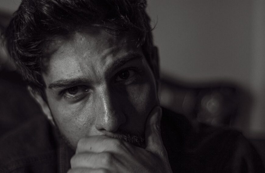 Expressive black and white portrait capturing deep thought and emotion.