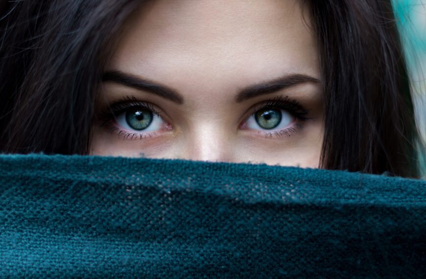a close up of a person with blue eyes