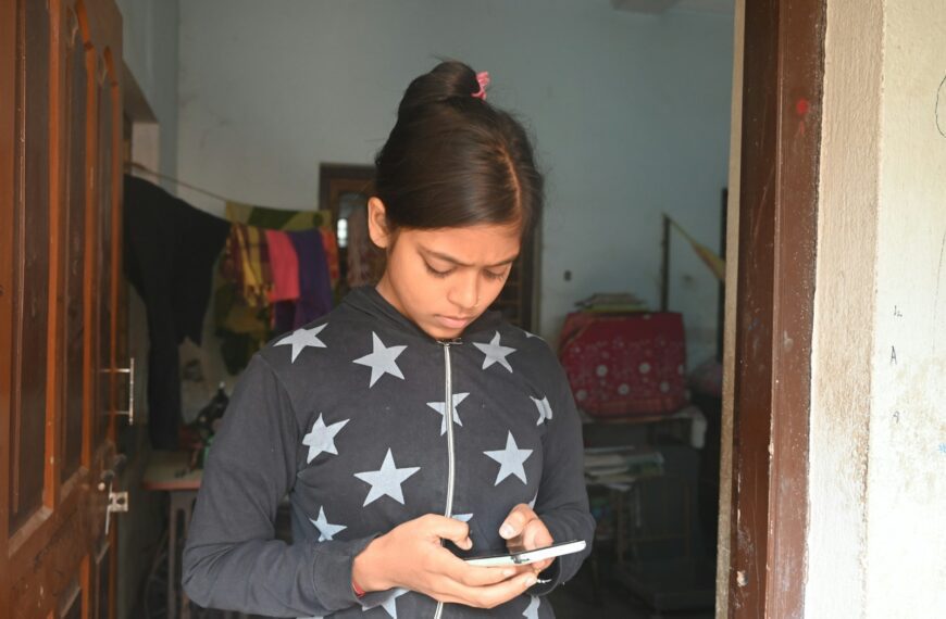 A girl is looking at her phone.