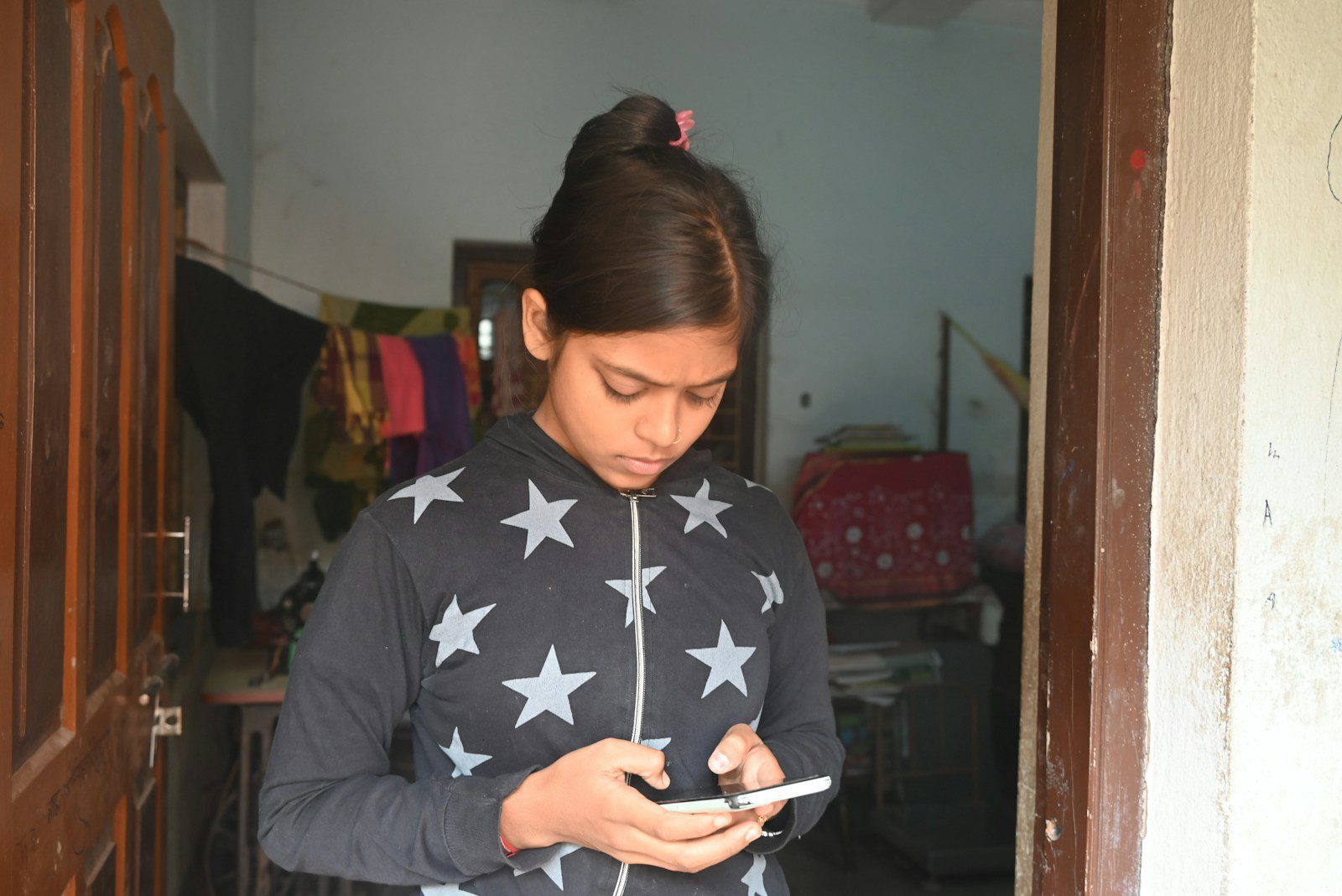 A girl is looking at her phone.