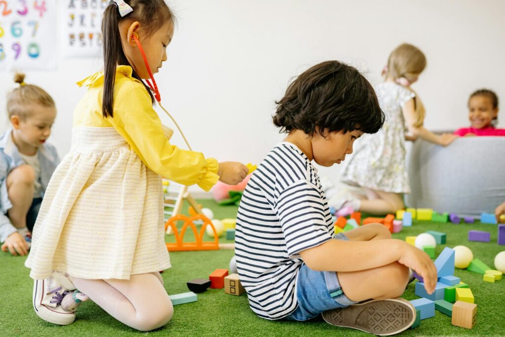 Joyful children engaged in playtime at a cheerful kindergarten setting.