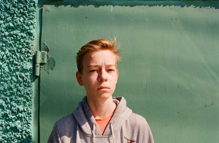 David Bradley standing in front of a mirror posing for the camera