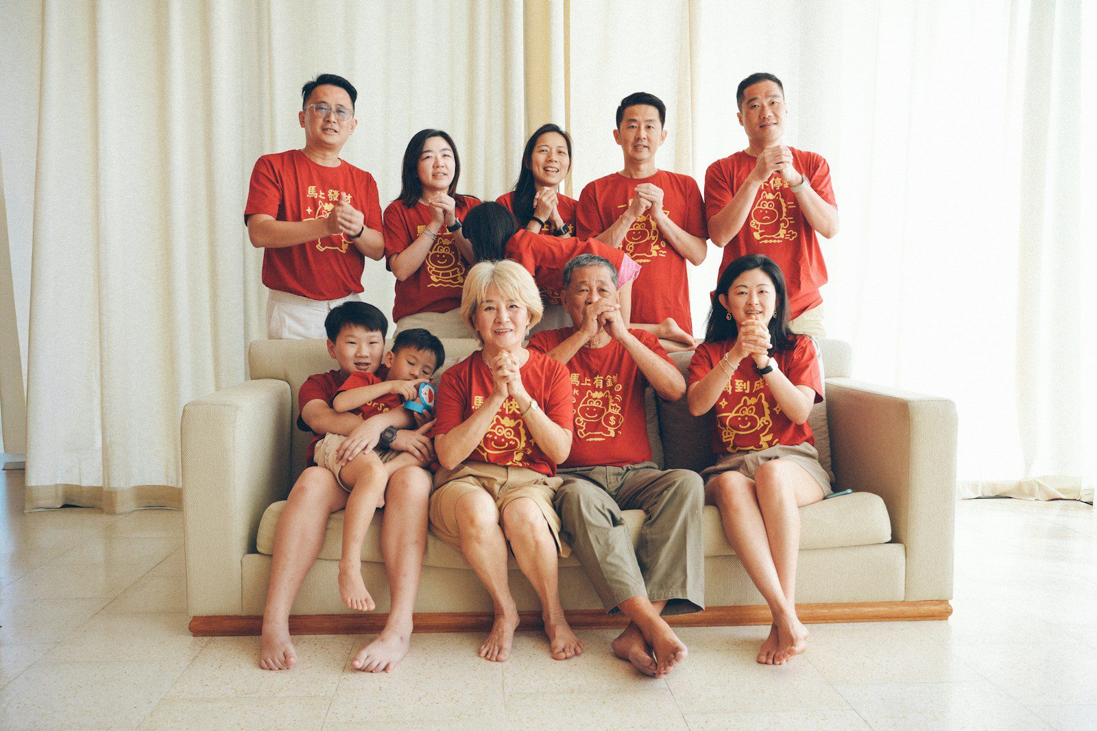 A multi-generational family poses for a photo