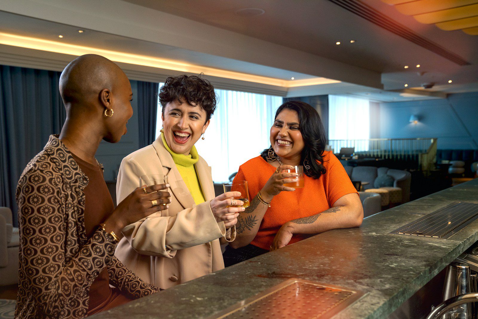 a group of people standing around a bar